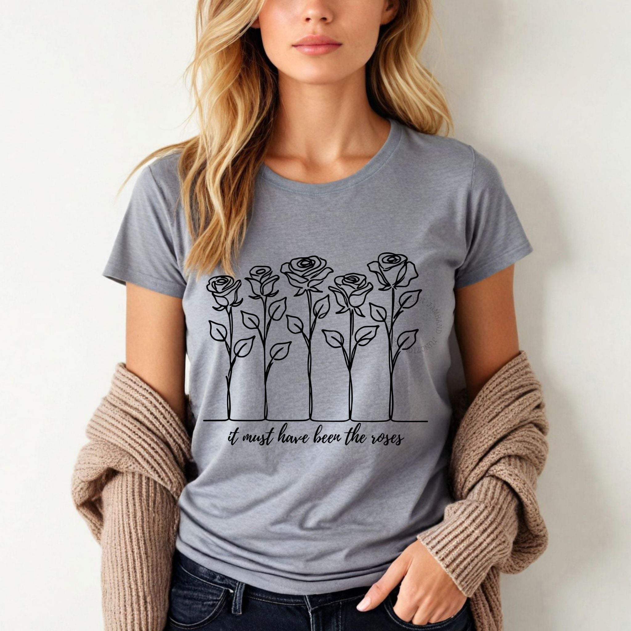 Women’s cut Grateful Dead t-shirt in soft pastel tones with lyric-inspired roses and vintage vibes.